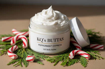 KQ’s BUTTAs Peppermint Cypress whipped body Butta 4oz surrounded by peppermint candies and cypress trees open top