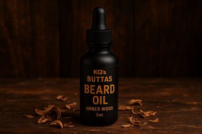 KQ's BUTTAs Amber Wood  beard oil in a 2 oz black bottle make background woodsy and manly