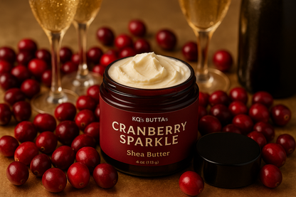 KQ's BUTTAs CRANBERRY SPARKLE Shea Butter open cosmetic jar surrounded by cranberries and champagne