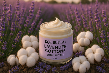 KQ's BUTTAs Lavender Cottons Body Butter in an open 4oz jar in a field of lavender surrounded by cotton